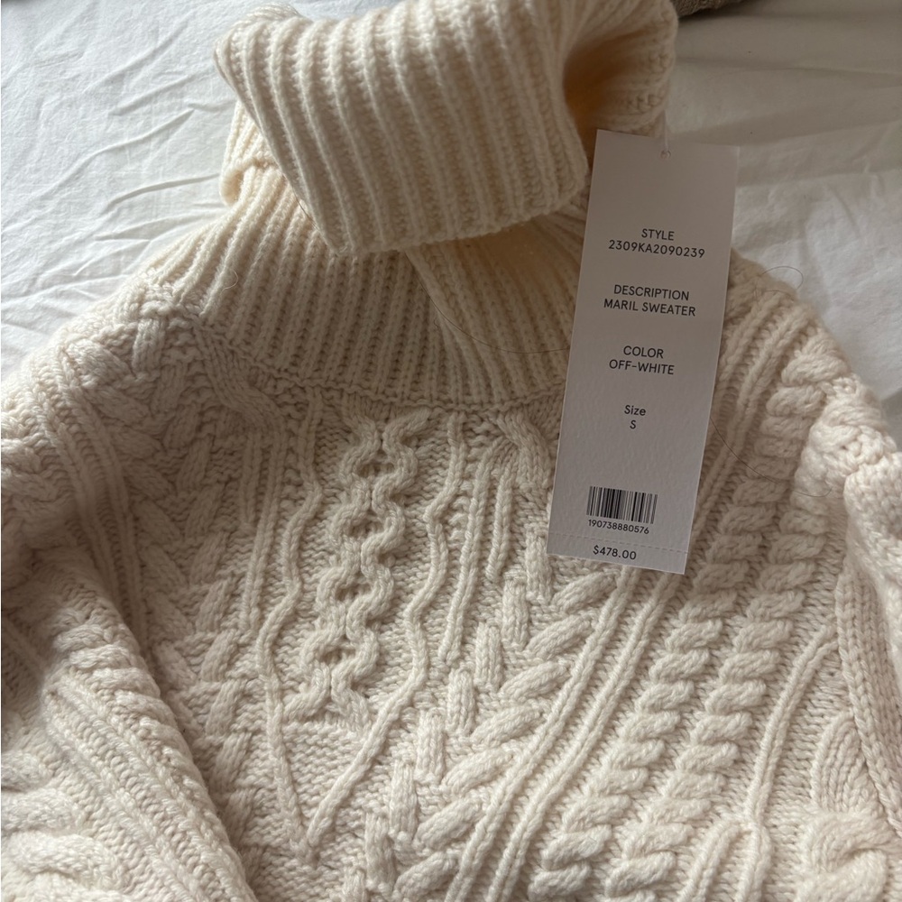Veronica beard knit turtleneck with striped detailing.